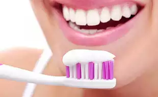 Here's The Scary Reason Why You Should Never Use Whitening Toothpaste, According To A Dentist