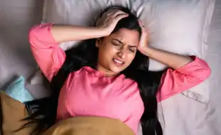 Can You Get a Headache From Lack of Sleep? Here's What Experts Say